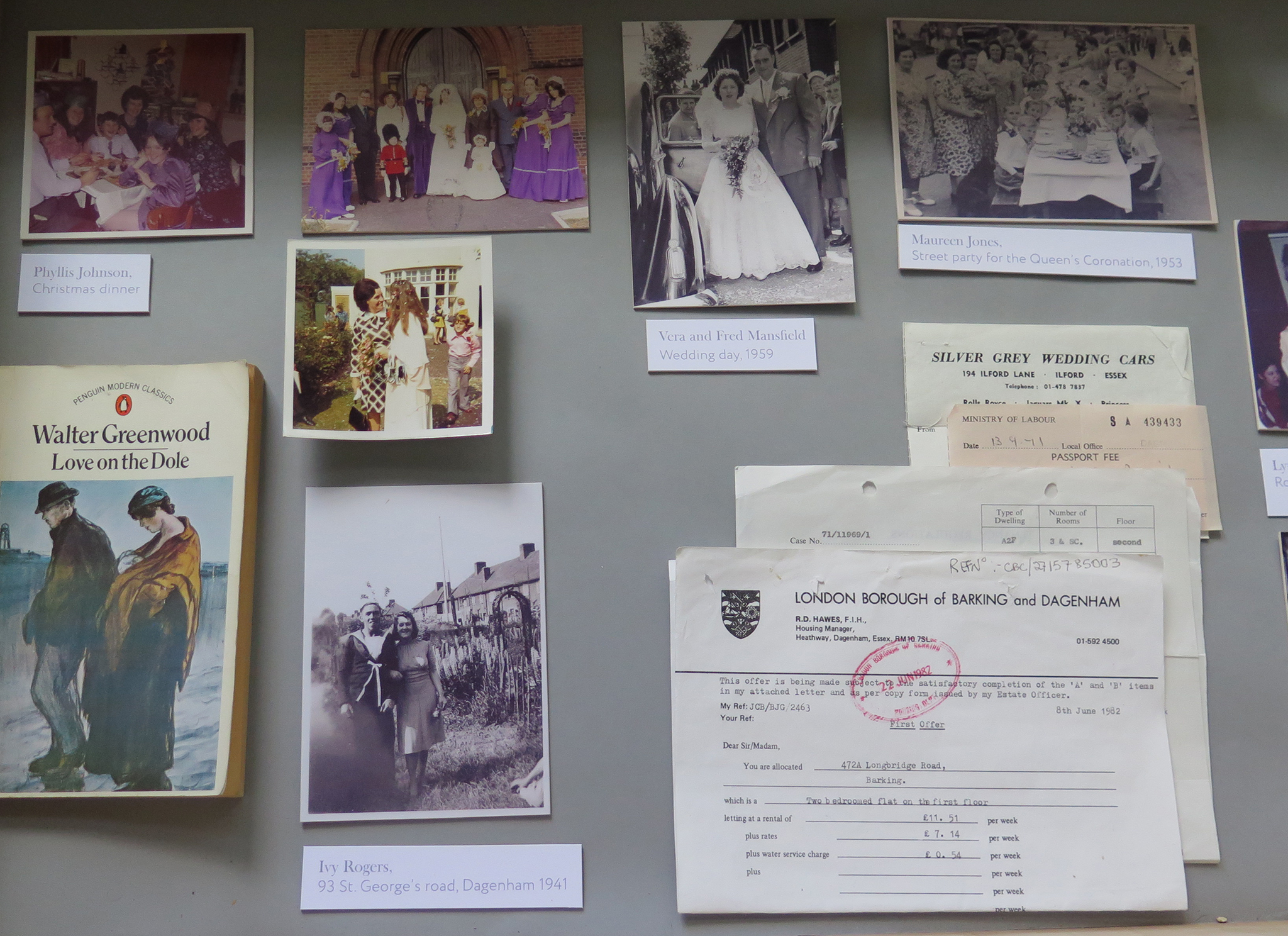 A display case with photographs of Barking residents and historical documents